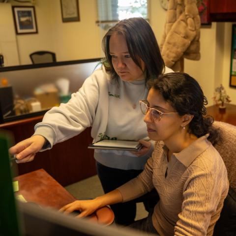 two people looking at a computer screen